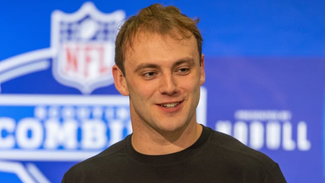 Brock Bowers looks to his side at the NFL scouting combine podium