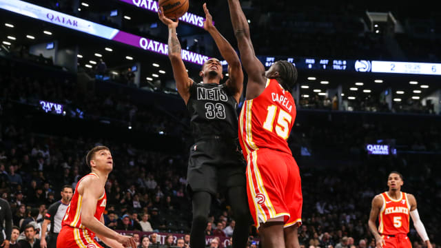 Feb 29, 2024; Brooklyn, New York, USA; Brooklyn Nets center Nic Claxton (33) moves to the basket against Atlanta Hawks center Clint Capela (15) in the first quarter at Barclays Center. Mandatory Credit: Wendell Cruz-USA TODAY Sports