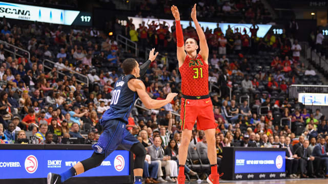 Apr 1, 2018; Atlanta, GA, USA; Atlanta Hawks forward Mike Muscala (31) shoots a three point shot over Orlando Magic forward Aaron Gordon (00) during the second half at Philips Arena. Mandatory Credit: Dale Zanine-USA TODAY Sports