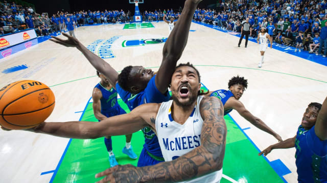 McNeese's Christian Shumate is blocked by TAMUCC's Stephen Giwa during the game at the American Bank Center on Monday, Jan. 22, 2024, in Corpus Christi, Texas.  