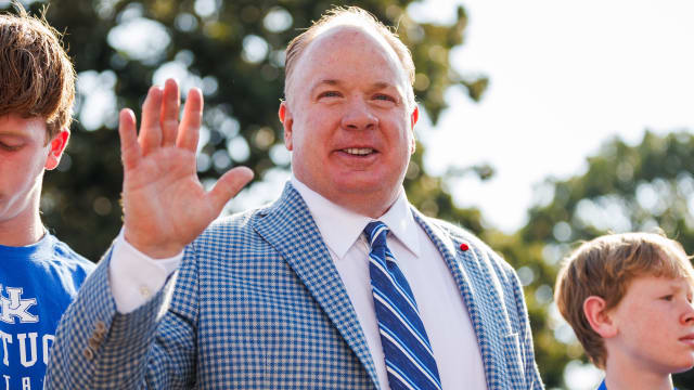 Sep 2, 2023; Lexington, Kentucky, USA; Kentucky Wildcats head coach Mark Stoops waves to fans at cat walk before the game against the Ball State Cardinals at Kroger Field. Mandatory Credit: Jordan Prather-USA TODAY Sports  