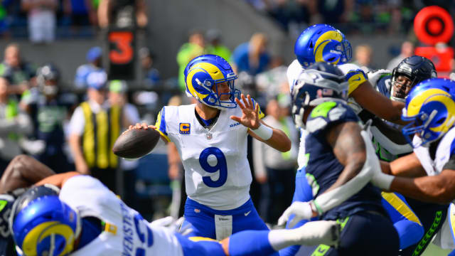  Sep 10, 2023; Seattle, Washington, USA; Los Angeles Rams quarterback Matthew Stafford (9) passes the ball against the Seattle Seahawks during the first half at Lumen Field. Mandatory Credit: Steven Bisig-USA TODAY Sports