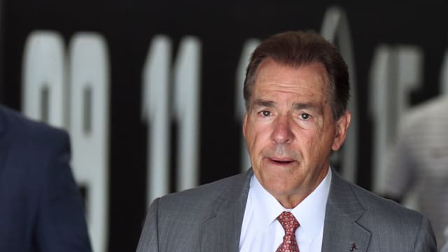 Alabama Crimson Tide head coach Nick Saban emerges from the tunnel to take his traditional walk around Bryant-Denny Stadium before a game against the Ole Miss Rebels.