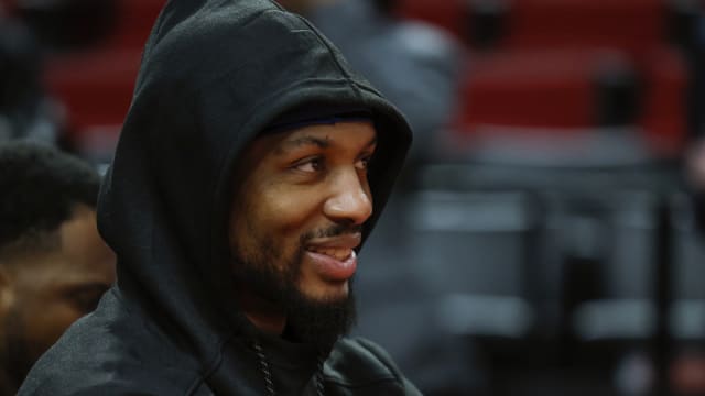 Portland Trail Blazers point guard Damian Lillard (0) watches players warm up