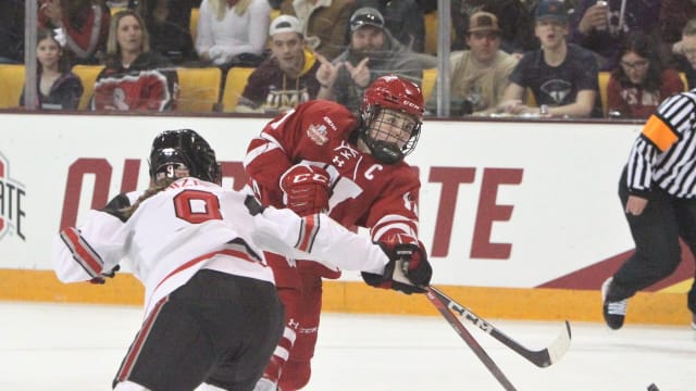 Wisconsin's Britta Curl (17) gets a shot past Ohio State's Madison Bizal during the first period of the NCAA Division I women's hockey championship game on Sunday March 19, 2023 at AMSOIL Arena in Duluth, Minn. Uwice Ohio State 2 March 19 2023