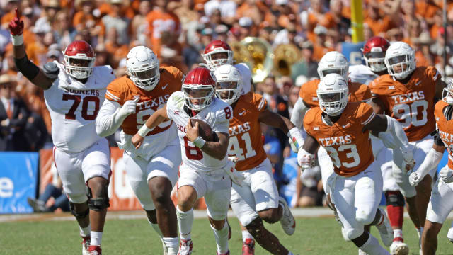 Oklahoma quarterback Dillon Gabriel carries the ball in the Red River Rivalry game against Texas.