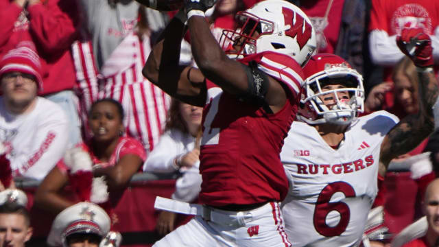 Wisconsin cornerback Ricardo Hallman (2) intercepts a pass intended for Rutgers wide receiver Christian Dremel (6) before returning it 95 yards for a touchdown during the second quarter of their game Saturday, Oct. 7, 2023, at Camp Randall Stadium in Madison, Wisconsin.