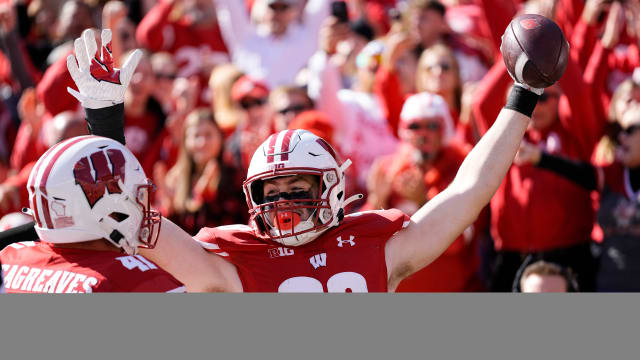 Oct 7, 2023; Madison, Wisconsin, USA; Wisconsin Badgers tight end Tucker Ashcraft (38) celebrates with wide receiver Skyler Bell (11) after scoring a touchdown during the fourth quarter against the Rutgers Scarlet Knights at Camp Randall Stadium. Mandatory Credit: Jeff Hanisch-USA TODAY Sports