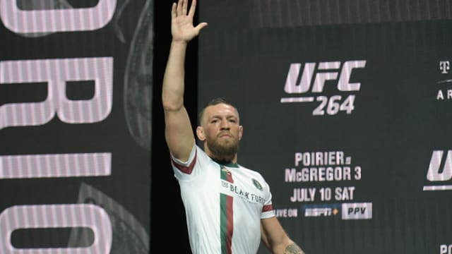 Conor McGregor acknowledges the crowd during the ceremonial weigh-ins for UFC 264.