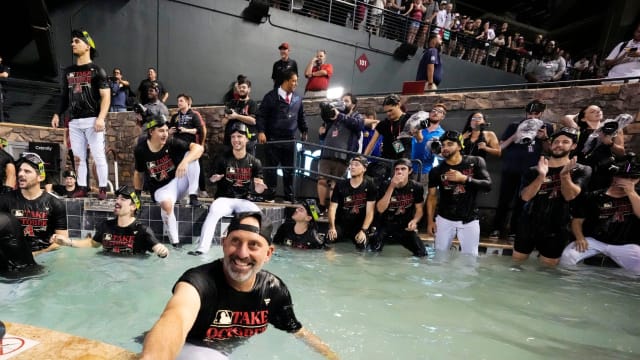 The Arizona Diamondbacks celebrate clinching a postseason spot in the Chase Field pool on September 30, 2023.