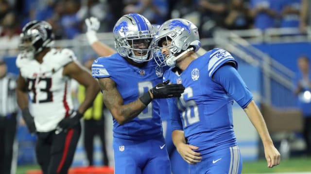 Detroit Lions wide receiver Josh Reynolds embraces Jared Goff