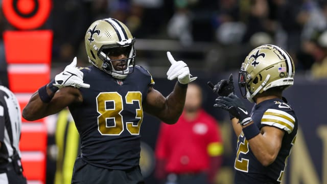 New Orleans Saints tight end Juwan Johnson (83) celebrates his touchdown catch with wide receiver Chris Olave (12)