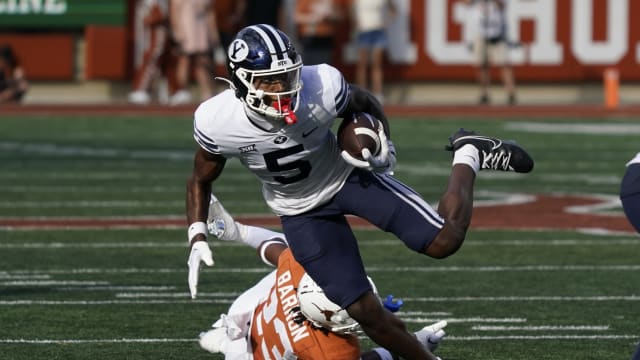 Oct 28, 2023; Austin, Texas, USA; Brigham Young Cougars wide receiver Darius Lassiter (5) runs for yardage after making a catch against the Texas Longhorns during the second half at Darrell K Royal-Texas Memorial Stadium.