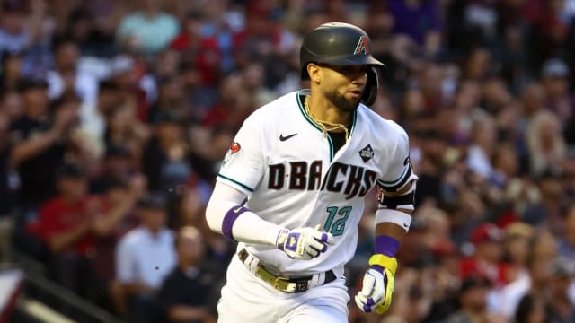 Nov 1, 2023; Phoenix, Arizona, USA; Arizona Diamondbacks left fielder Lourdes Gurriel Jr. (12) runs to first base after hitting a single against the Texas Rangers during the second inning in game five of the 2023 World Series at Chase Field.