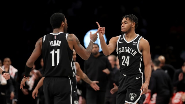  Brooklyn Nets guards Kyrie Irving (11) and Cam Thomas (24) celebrate during the fourth quarter against the Los Angeles Lakers 