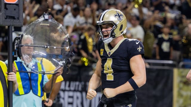 New Orleans Saints quarterback Derek Carr (4) reacts to quarterback Taysom Hill (7) making a touchdown