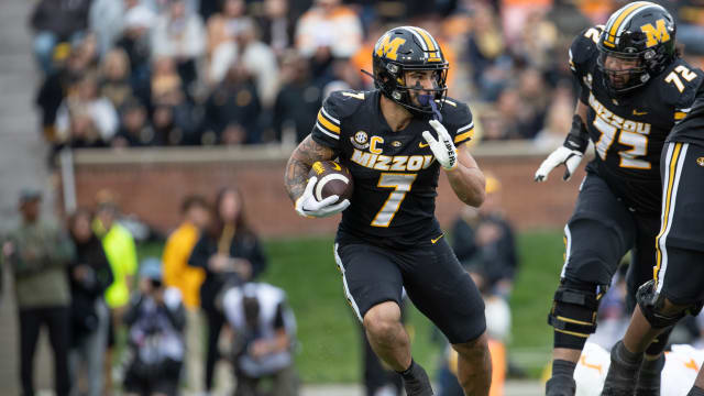 Nov 11, 2023; Columbia, Missouri, USA; Missouri Tigers running back Cody Schrader (7) runs with the ball at Faurot Field at Memorial Stadium.