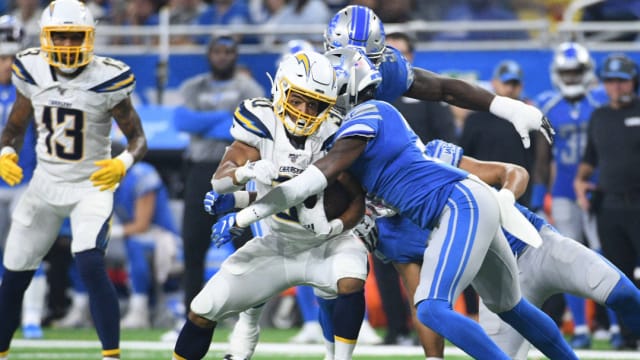 Detroit Lions Tracy Walker tackles Los Angeles Chargers Austin Ekeler.