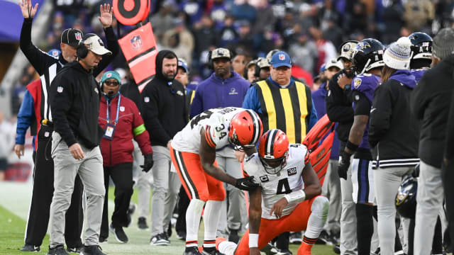 Nov 12, 2023; Baltimore, Maryland, USA; Cleveland Browns quarterback Deshaun Watson (4) is helped up by running back Jerome Ford (34) after being tackled out of bounds during the second half against the Baltimore Ravens at M&T Bank Stadium.