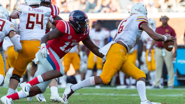 Oct 6, 2018; Oxford, MS, USA; Louisiana Monroe Warhawks quarterback Caleb Evans (6) runs away from Mississippi Rebels linebacker Willie Hibbler (17) during the second half at Vaught-Hemingway Stadium. Mandatory Credit: Vasha Hunt-USA TODAY Sports  