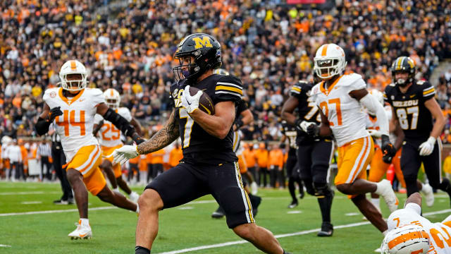 Nov 11, 2023; Columbia, Missouri, USA; Missouri Tigers running back Cody Schrader (7) runs the ball against the Tennessee Volunteers during the second half at Faurot Field at Memorial Stadium. Mandatory Credit: Jay Biggerstaff-USA TODAY Sports