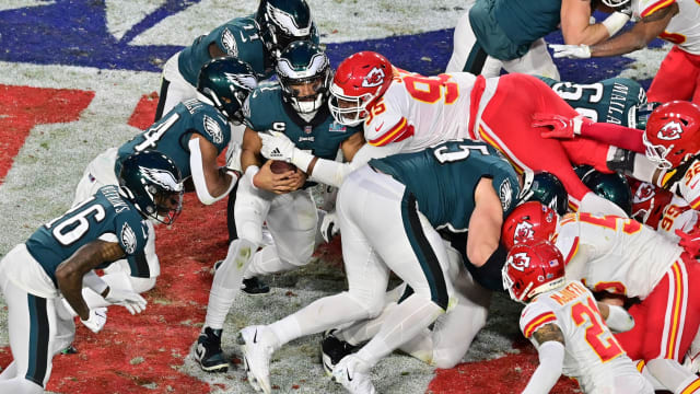 Feb 12, 2023; Glendale, Arizona, US; Kansas City Chiefs defensive tackle Chris Jones (95) tackles Philadelphia Eagles quarterback Jalen Hurts (1) on a quarterback sneak during the second quarter of Super Bowl LVII at State Farm Stadium. Mandatory Credit: Matt Kartozian-USA TODAY Sports  