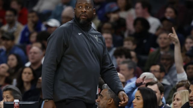 Milwaukee Bucks head coach Adrian Griffin looks on from the bench against the Washington Wizards 