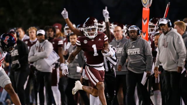 Mississippi State Bulldogs wide receiver Zavion Thomas (1) runs the ball for a first down during the first half against the Mississippi Rebels at Davis Wade Stadium at Scott Field.