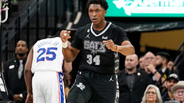 San Antonio Spurs forward Stanley Johnson (34) reacts after being fouled