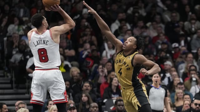 Toronto Raptors forward Scottie Barnes (4) defends against a shot by Chicago Bulls guard Zach LaVine (8) during the first half at Scotiabank Arena.