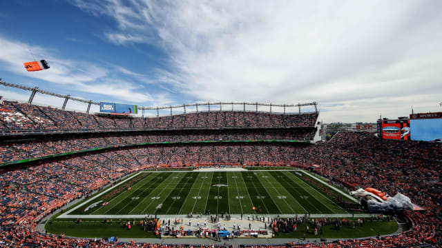 Oct 9, 2016; Denver, CO, USA; Fans watch as the Denver Broncos Thunderstorm parachute team jumps into the stadium before the game against the Atlanta Falcons at Sports Authority Field at Mile High. Mandatory Credit: Isaiah J. Downing-USA TODAY Sports