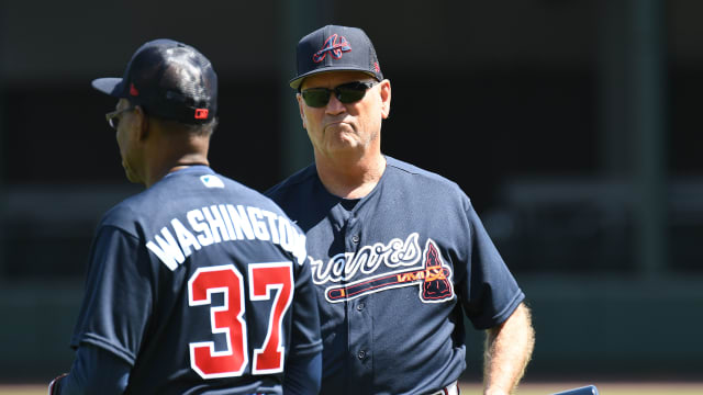 Mar 14, 2022; North Port, FL, USA; Atlanta Braves manager Brian Snitker (43) and third base coach Ron Washington (37) watch the workout during spring training. Mandatory Credit: Jonathan Dyer-USA TODAY Sports  