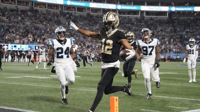 New Orleans Saints wide receiver Chris Olave (12) crosses the goal line but was ruled to have stepped out of bounds earlier