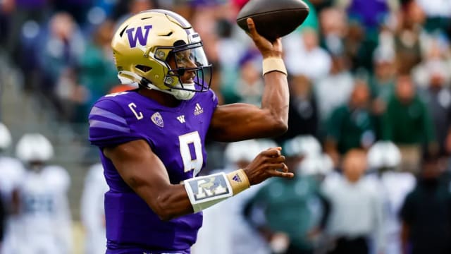 Washington QB Michael Penix Jr. attempts a pass against Michigan State.