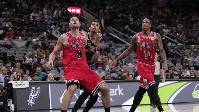 Chicago Bulls center Nikola Vucevic (9) and forward DeMar DeRozan (11) block out San Antonio Spurs center Victor Wembanyama (1) in the second half at the Frost Bank Center.