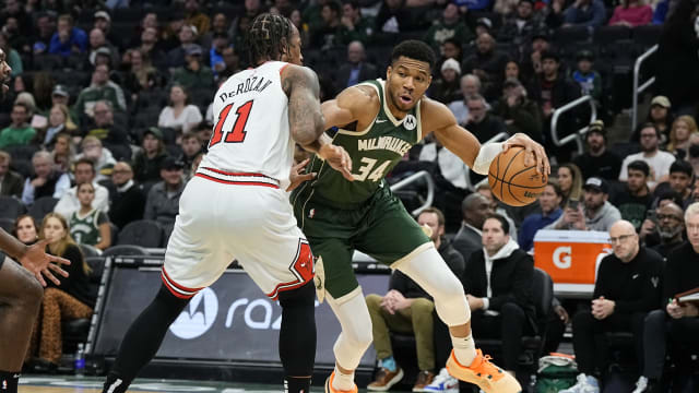 Milwaukee Bucks forward Giannis Antetokounmpo (34) drives for the basket against Chicago Bulls forward DeMar DeRozan (11) during the third quarter at Fiserv Forum. 