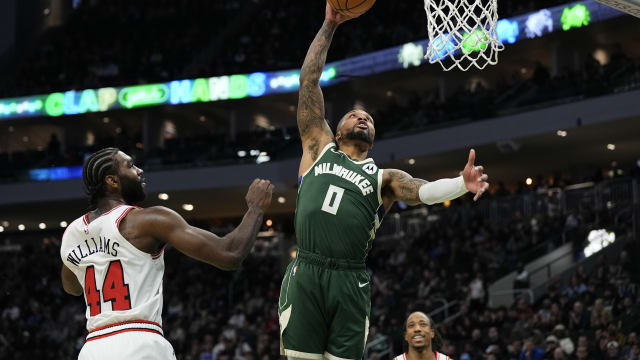 Milwaukee Bucks guard Damian Lillard (0) dunks in front of Chicago Bulls forward Patrick Williams (44) 