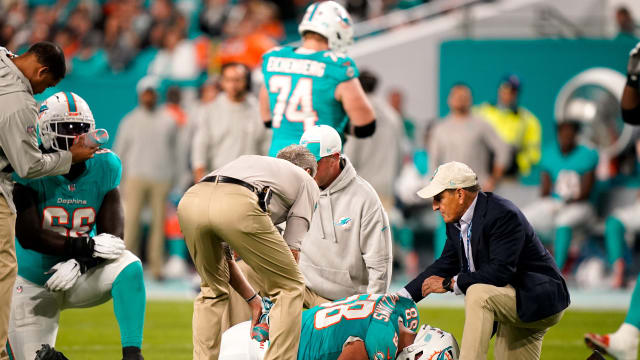 Dolphins' C Connor Williams suffers an injury against Tennessee