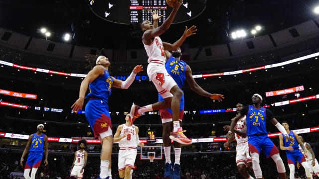 Denver Nuggets center DeAndre Jordan (6) defends Chicago Bulls guard Ayo Dosunmu (12) during the second half at United Center.