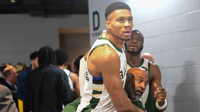  Milwaukee Bucks forward Giannis Antetokounmpo (34) is restrained by a coach outside the Indiana Pacers 