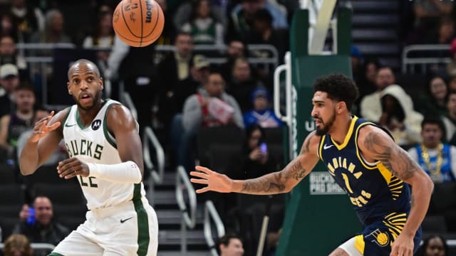 Milwaukee Bucks center Khris Middleton (22) receives a pass against Indiana Pacers forward Obi Toppin (1)