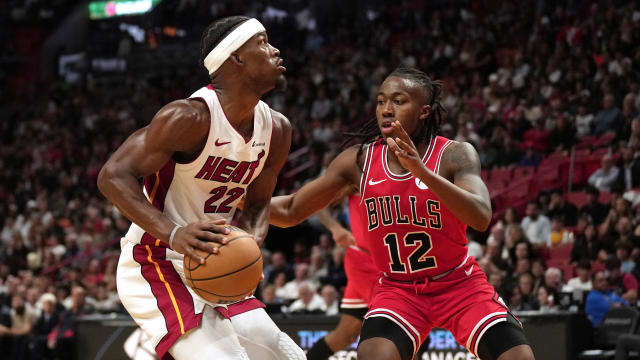 Miami Heat forward Jimmy Butler (22) goes up for a shot as Chicago Bulls guard Ayo Dosunmu (12) defends during the second half at Kaseya Center