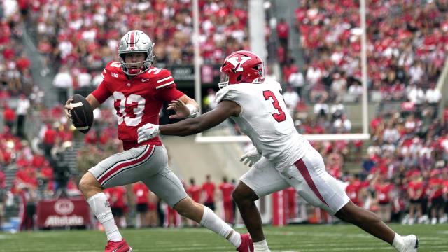Ohio State Buckeyes quarterback Devin Brown (33) is sacked by Youngstown State Penguins linebacker Alex Howard (3) during their NCAA football game at Ohio Stadium