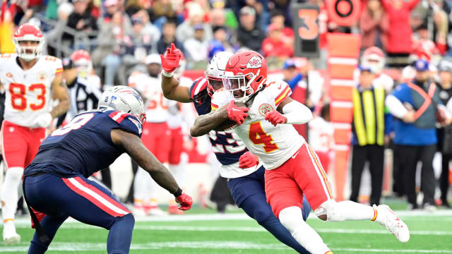 Dec 17, 2023; Foxborough, Massachusetts, USA; Kansas City Chiefs wide receiver Rashee Rice (4) runs the ball as New England Patriots safety Kyle Dugger (23) chases him during the first half at Gillette Stadium. Mandatory Credit: Eric Canha-USA TODAY Sports  