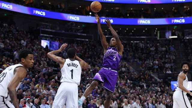 Utah Jazz guard Collin Sexton (2) shoots the ball over Brooklyn Nets forward Mikal Bridges (1)