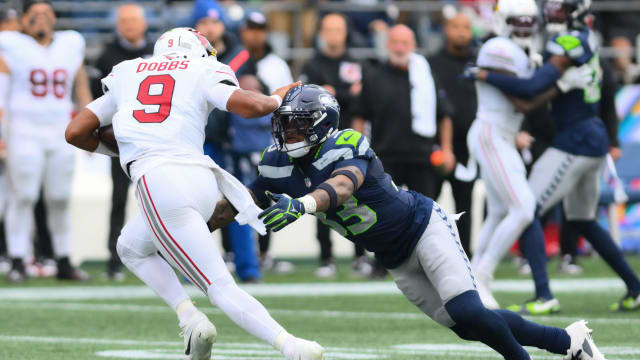 Seattle Seahawks safety Jamal Adams (33) dives for Arizona Cardinals quarterback Joshua Dobbs (9) during the game at Lumen Field.