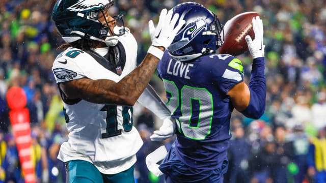 Seattle Seahawks safety Julian Love (20) intercepts a pass intended for Philadelphia Eagles wide receiver Quez Watkins (16) during the fourth quarter at Lumen Field. 