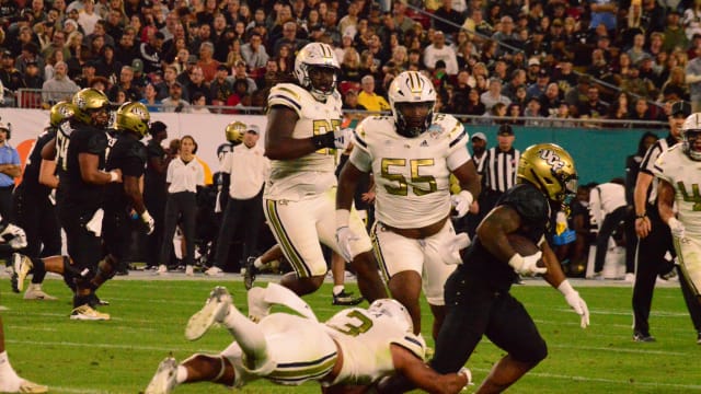 Georgia Tech tackling a UCF running back