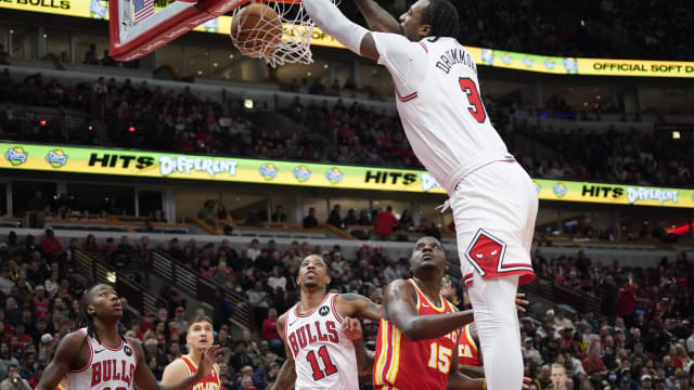 Chicago Bulls center Andre Drummond (3) dunks the ball over Atlanta Hawks center Clint Capela (15) during the first quarter at United Center.