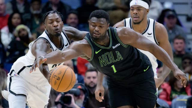 Brooklyn Nets forward Dorian Finney-Smith (28) steals the ball from New Orleans Pelicans forward Zion Williamson (1)